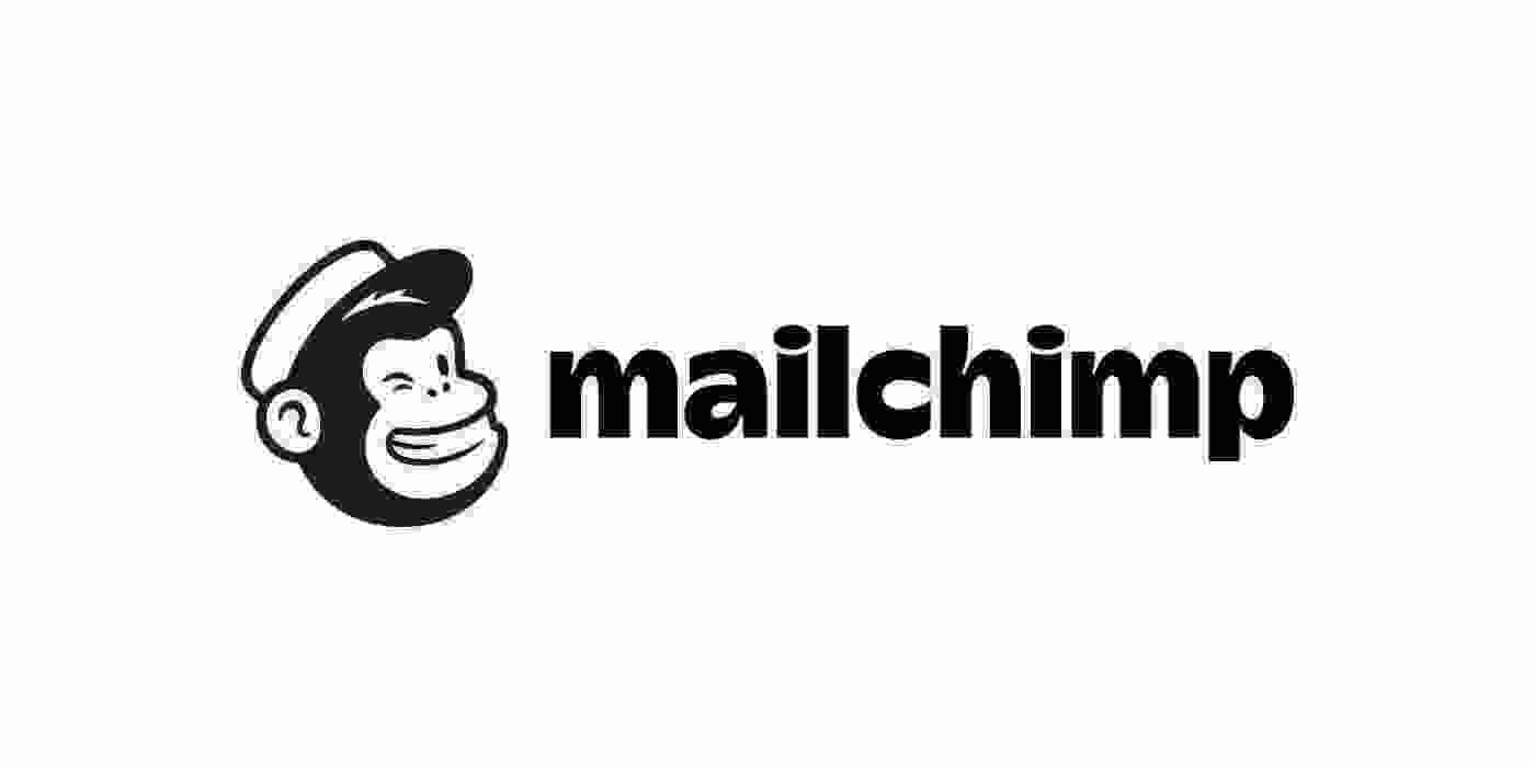 Mailchimp logo with a smiling black-and-white chimp head wearing a hat, next to bold lowercase “mailchimp” text.