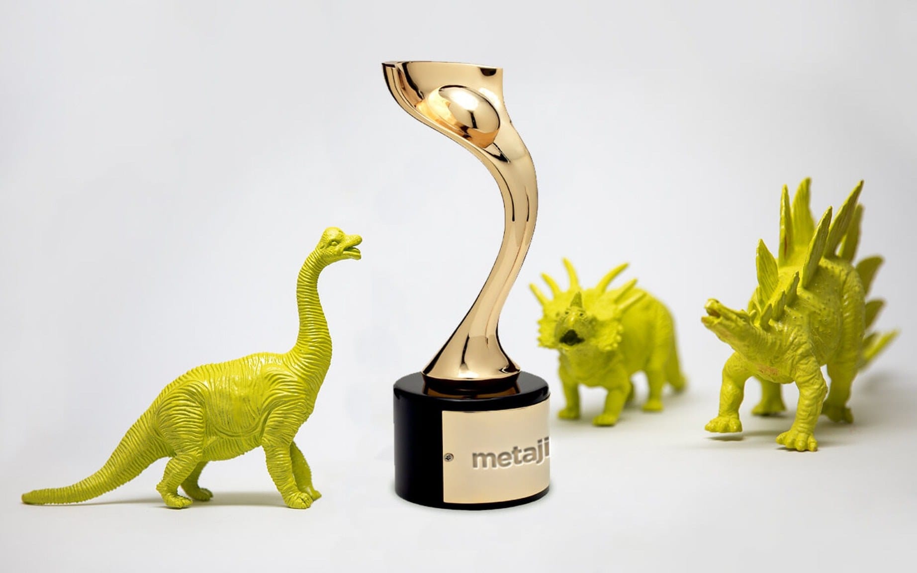 Gold curved-twist trophy on a black base, surrounded by neon yellow-green dinosaur figurines on a white background.