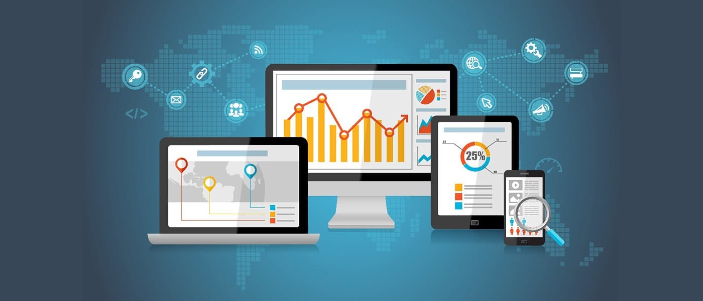 Multi-device analytics illustration with a laptop, desktop monitor, tablet, and smartphone displaying charts and graphs over a blue world map background.
